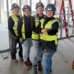 Women at construction site.